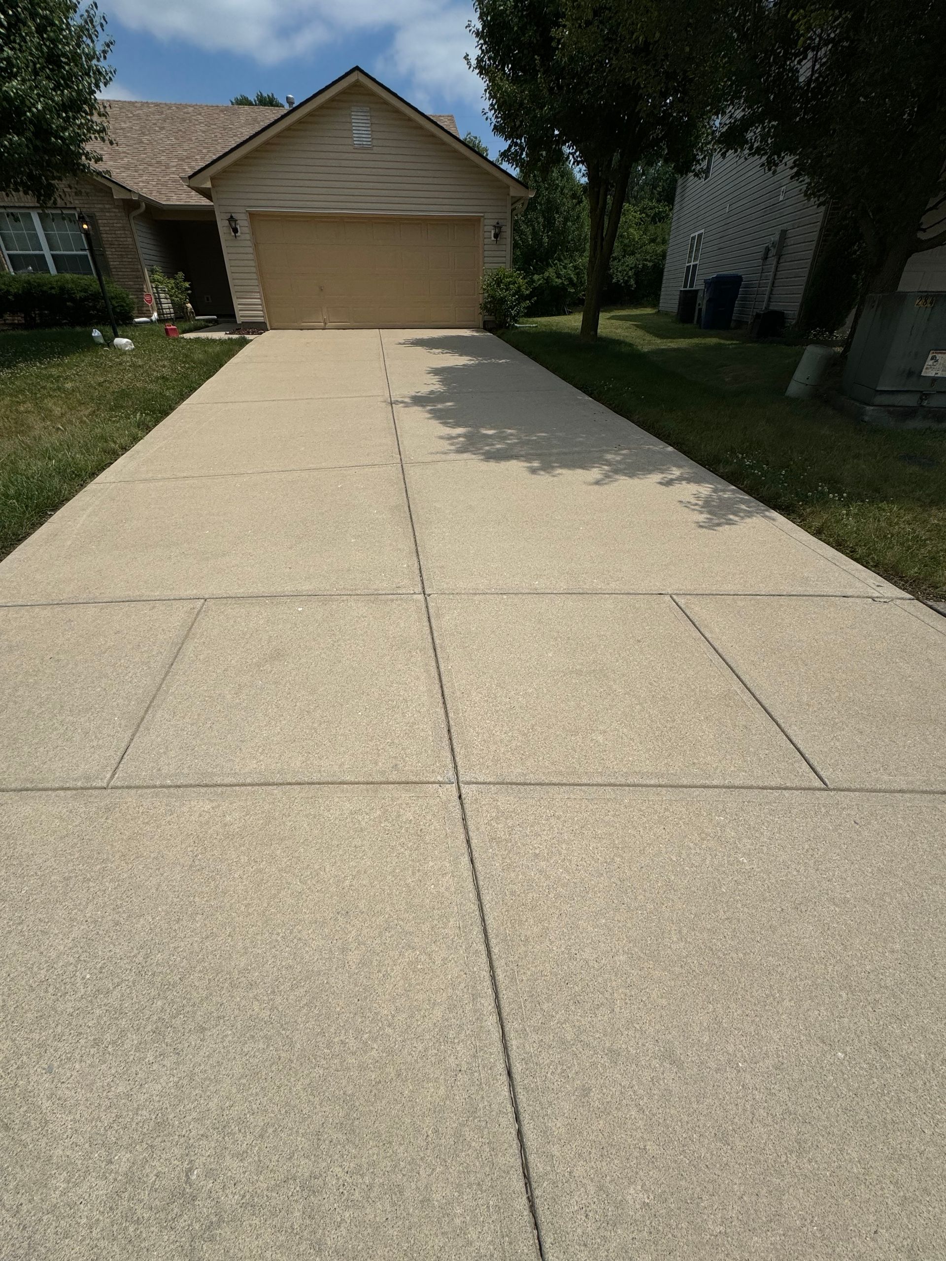 Freshly cleaned residential driveway in Indianapolis